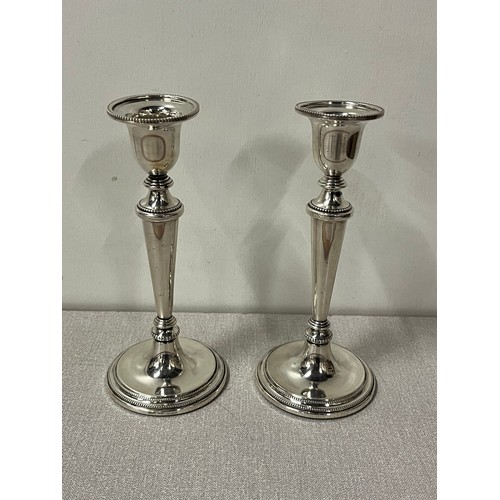 1 - A pair of sterling silver hallmarked candle sticks stamped B & Co (Broadway Silversmiths Birmingham)... 