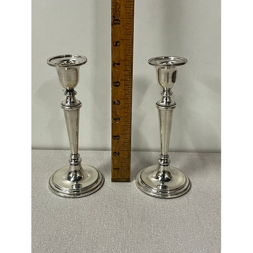 1 - A pair of sterling silver hallmarked candle sticks stamped B & Co (Broadway Silversmiths Birmingham)... 