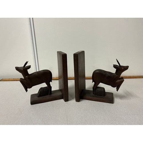 48 - Pair of wooden carved antelope bookends. 18cm x 15cm