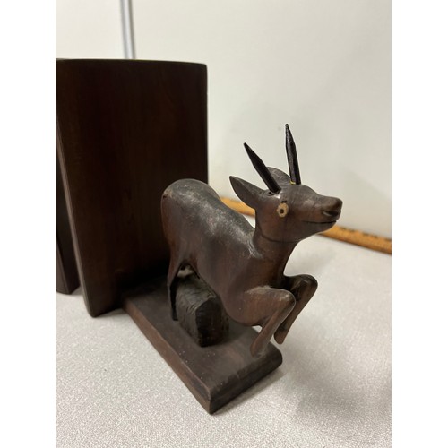 48 - Pair of wooden carved antelope bookends. 18cm x 15cm