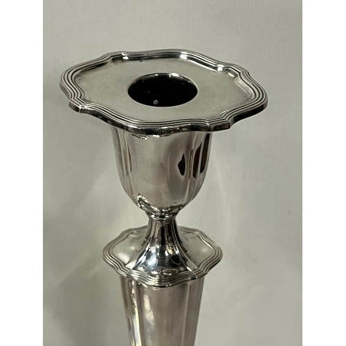 65 - Large pair of good quality silver plated candle sticks by Walker & Hall with removable toppers. 
30c... 