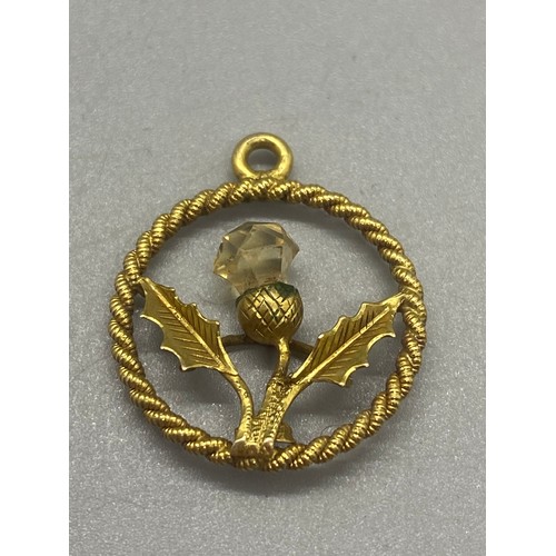 4 - 9ct gold thistle pendant along with 9ct earrings 5.3grams