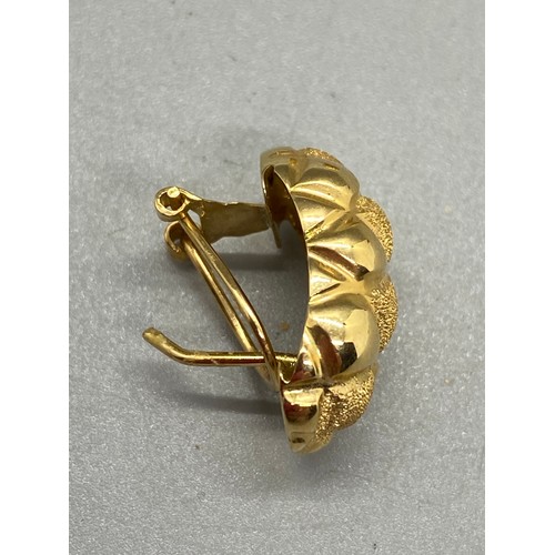 194 - a pair of 18ct gold earrings. 6.25g