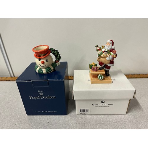 39 - 2 boxed Royal Doulton figures - Snowman and Rooftop Santa.