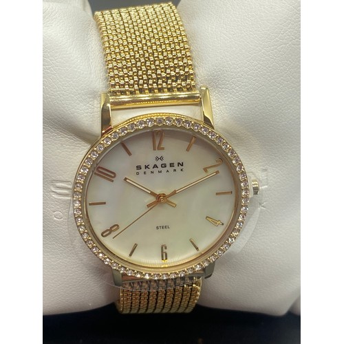 145B - New Skagan ladies wrist with mother of pearl face. Comes with box and booklet.