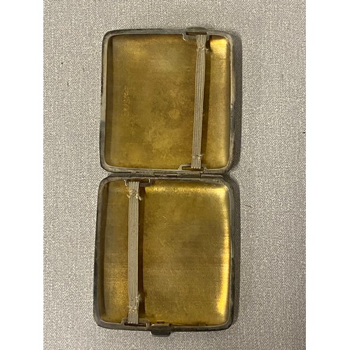 386 - White metal cigarette case along with white metal Vesta case decorated with shamrocks.