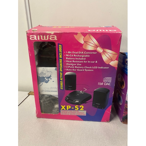 478 - Boxed mini sewing machine, portable cd player and speakers and jewellery cleaner.