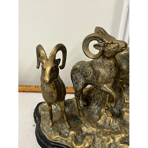 3 - Large heavy brass family grouping of mountain goats on wooden base. 
38cm l