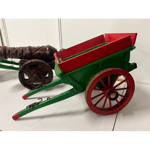 332 - 2 large hand made wooden carts along with cannon