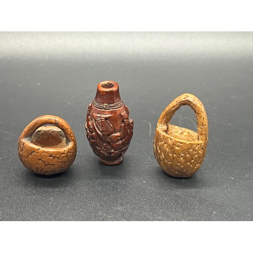 85 - 2 antique carved peach pit miniature baskets along with carved bead/netsuke?