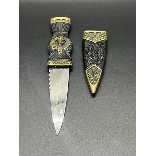 88 - Ornate Sgian Dubh with Gaelic piper motif.
18.5cm inc sheath