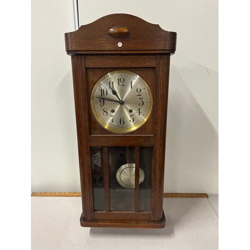 160 - Vintage oak cased wall clock by Embee with key & pendulum working.