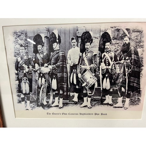 212 - Framed print of the Queen's own Cameron highlanders pipe band. 
43cm x 35cm