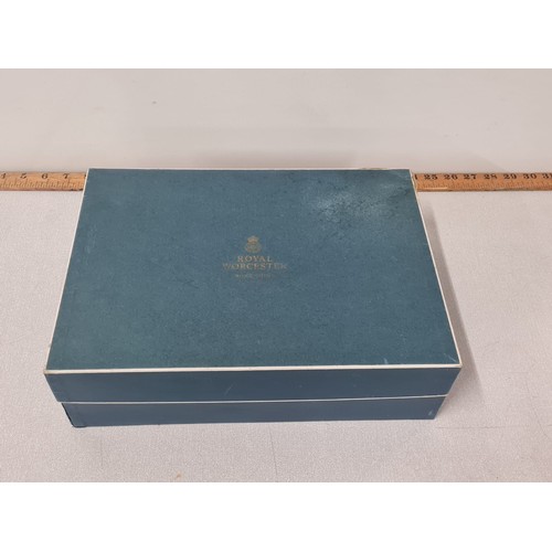 123 - Boxed Royal Worcester bone China 12 piece tea set.