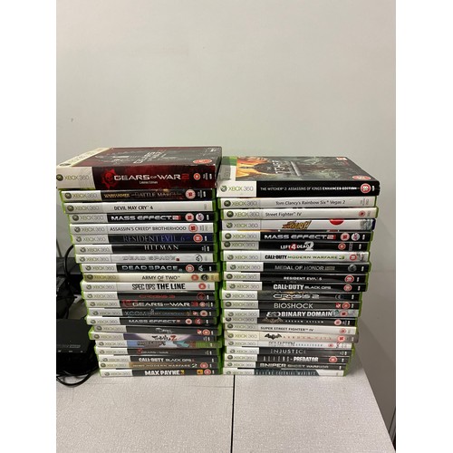 230 - Xbox 360 with 2 controllers charging unit & selection of games. powering up.