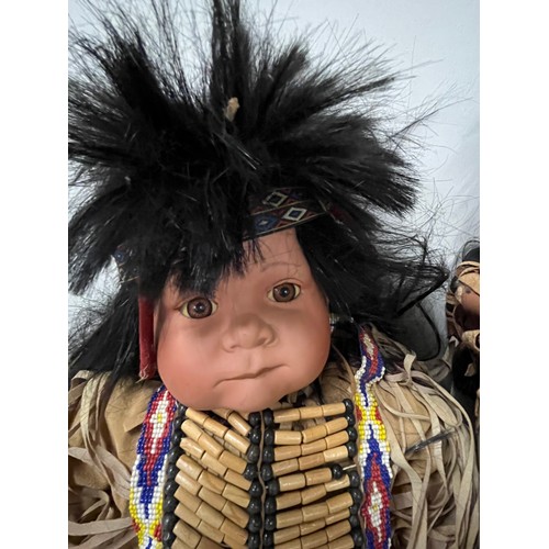 237 - 2 Porcelain Native American Baby dolls.