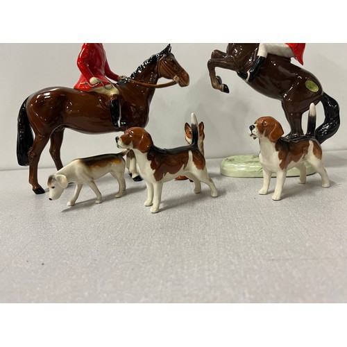 276 - 2 vintage beswick huntsmen on horseback along with hounds & fox.