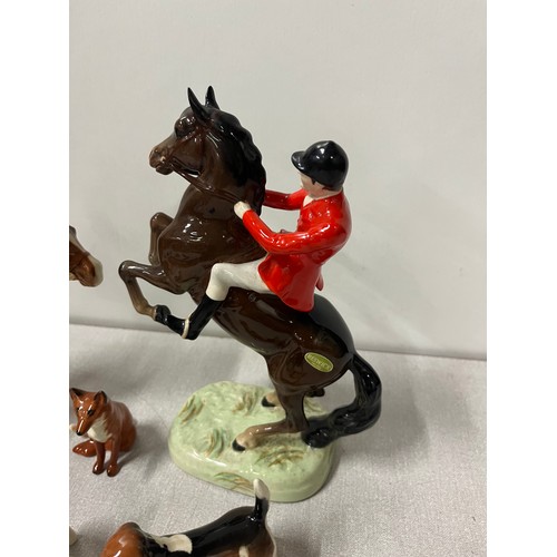 276 - 2 vintage beswick huntsmen on horseback along with hounds & fox.