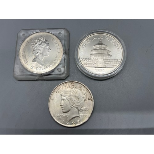 420 - 1990 silver 1oz Kookaburra silver bullion coin in capsule along with silver 1923 1 dollar peace coin... 