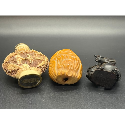 86 - Netsuke elephant along with oriental carved snuff bottle & small carved owl.