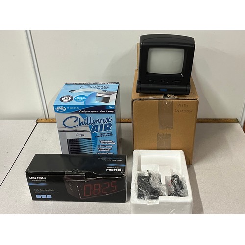 320 - new boxed tv, along with radio & cooler