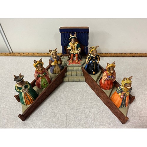 14 - Royal Doulton Bunnykins Henry the VIII & his 6 wives along with stand, all boxed.