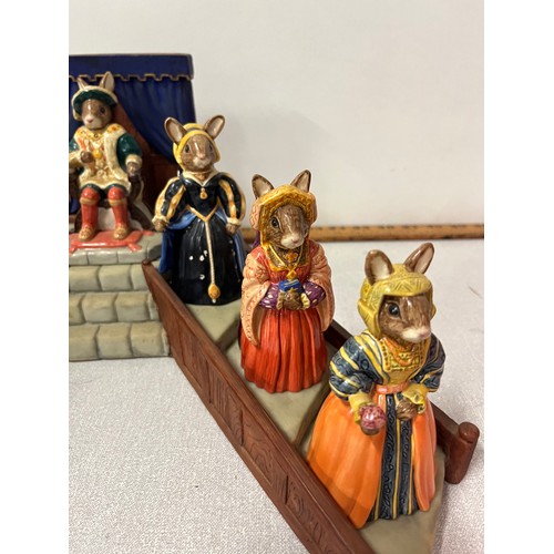 14 - Royal Doulton Bunnykins Henry the VIII & his 6 wives along with stand, all boxed.