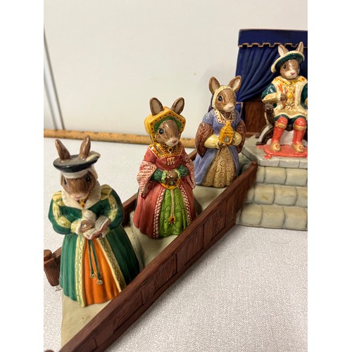 14 - Royal Doulton Bunnykins Henry the VIII & his 6 wives along with stand, all boxed.