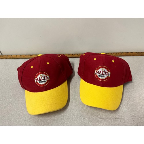 321 - 7 Malta Guinness baseball hats.