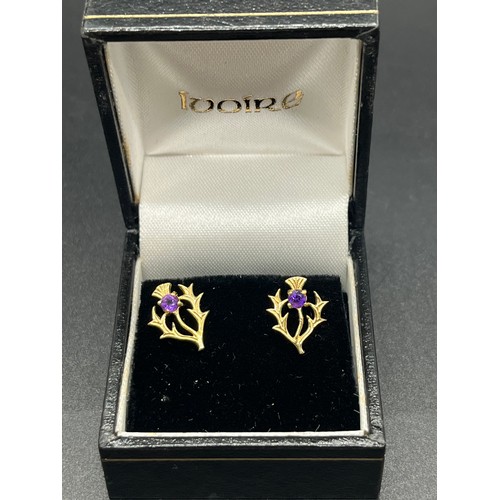 37 - Pair of 9ct gold and amethyst thistle earrings.