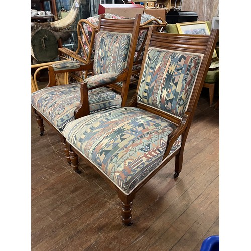 53 - Victorian oak upholstered his & hers parlor chairs on castor feet.