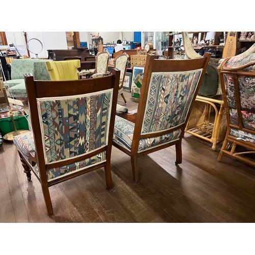 53 - Victorian oak upholstered his & hers parlor chairs on castor feet.