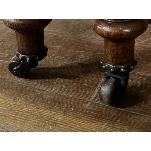 53 - Victorian oak upholstered his & hers parlor chairs on castor feet.