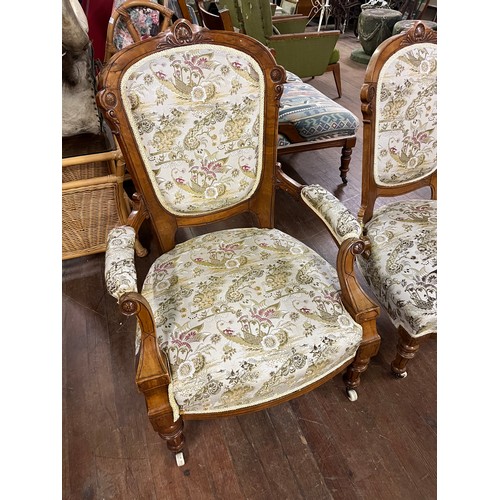 137 - Pair of Victorian light mahogany chinoiserie spoon back his & hers chairs on castor feet.