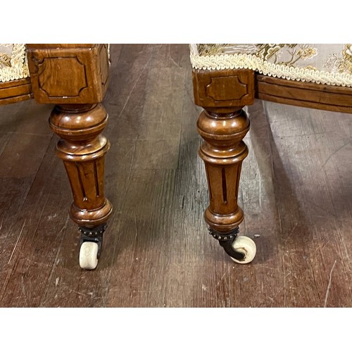 137 - Pair of Victorian light mahogany chinoiserie spoon back his & hers chairs on castor feet.