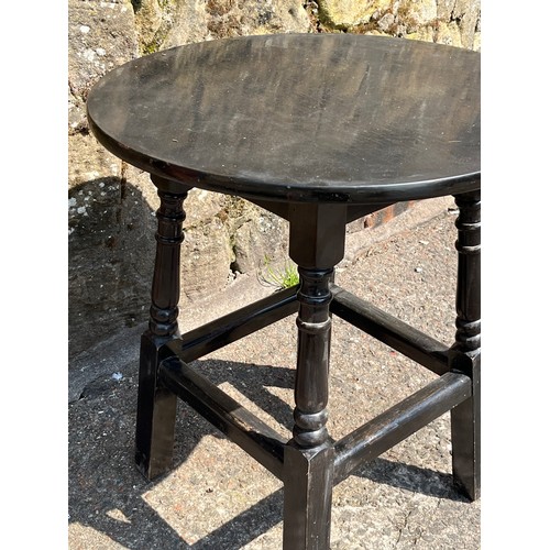 154 - Small solid wood black turned leg pub style table 
24