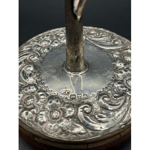 45 - Silver hallmarked ring holder on wooden base.