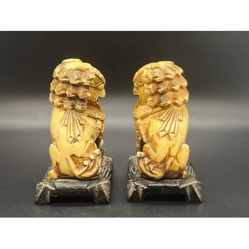 56 - Pair of vintage carved foo dogs.
3