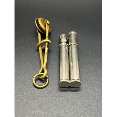 62 - Antique brass skirt lifter circa 1800's along with lighter stamped Alexander.