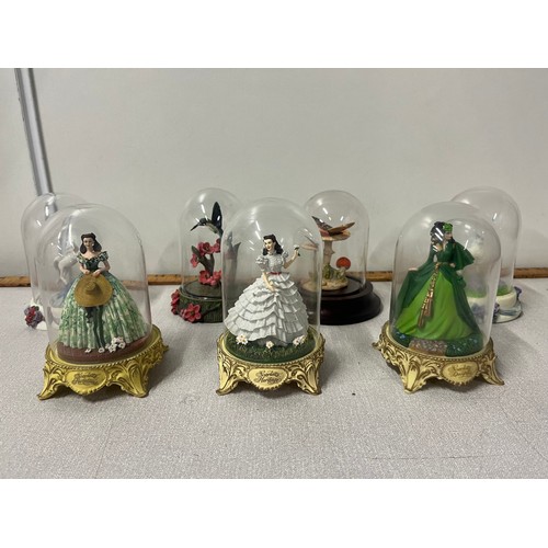 272 - 7  glass domed ornaments to include gone with the wind figurines to include The Franklin Mint