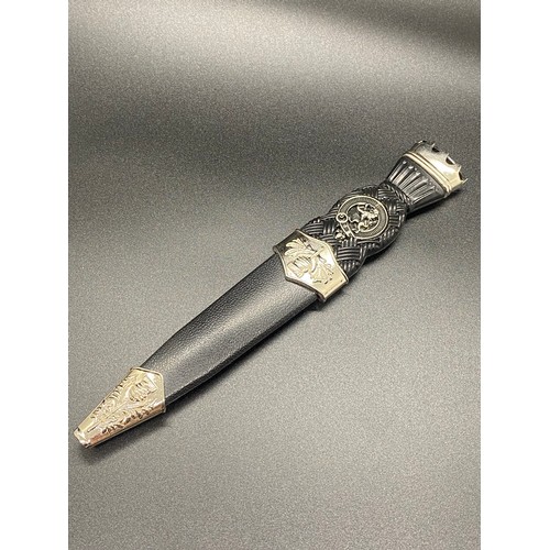 58 - Sgian Dubh with thistle and stone top and lion rampant crest.