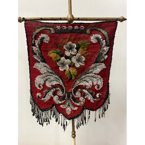 4 - Victorian aesthetic movement pole screen with beadwork shield shaped banner upon brass pole supporte... 