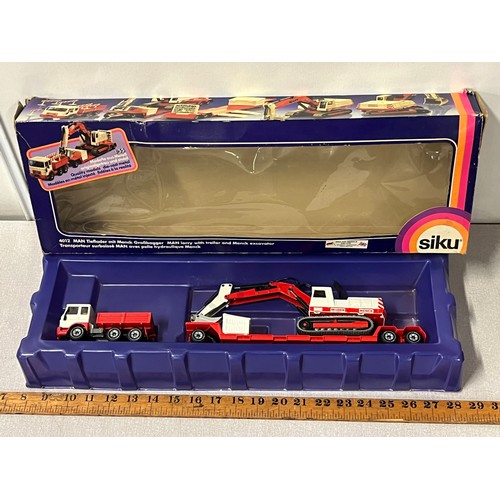 21 - Vintage boxed German Siku diecast Man lorry with trailer & Menck excavator model 4012