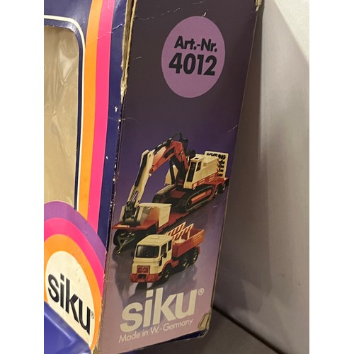 21 - Vintage boxed German Siku diecast Man lorry with trailer & Menck excavator model 4012