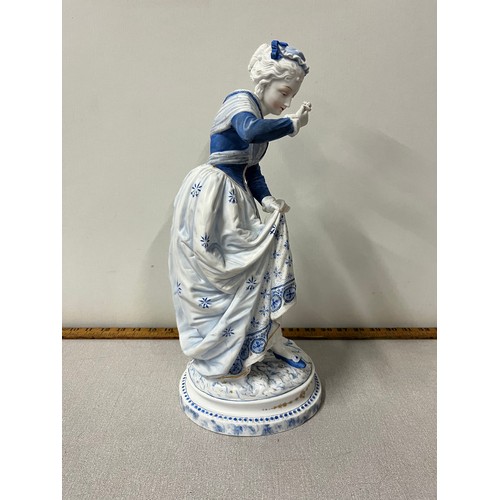 63 - Large Victorian bisque figurine of lady lifting skirt looking at flower, possibly Dresden?
15