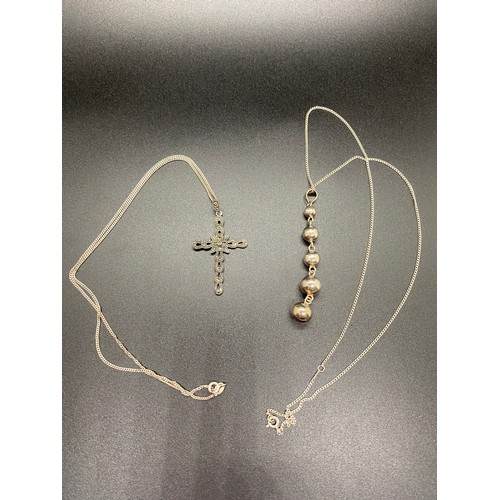 66 - Silver chain with silver cross pendant along with silver chain and ball pendant.