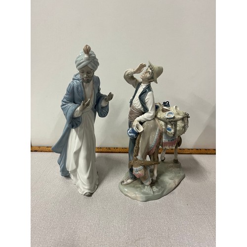 163 - Lladro 'Typical Peddler' with donkey retired #4859 along with Nao figure. tallest 11 inches