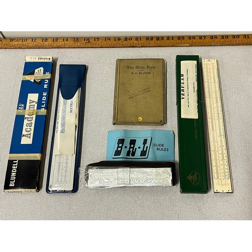 491 - Selection of slide rules and vintage book etc.