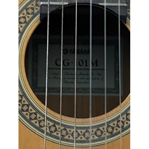 200 - Yamaha CG-101M acoustic guitar along with 1 other.