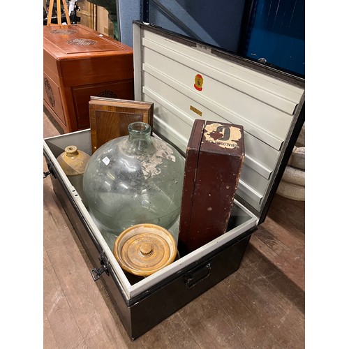52 - Large metal shipping trunk by Spider Brand 'The Protector' along with large glass demijohn, 2 stonew... 